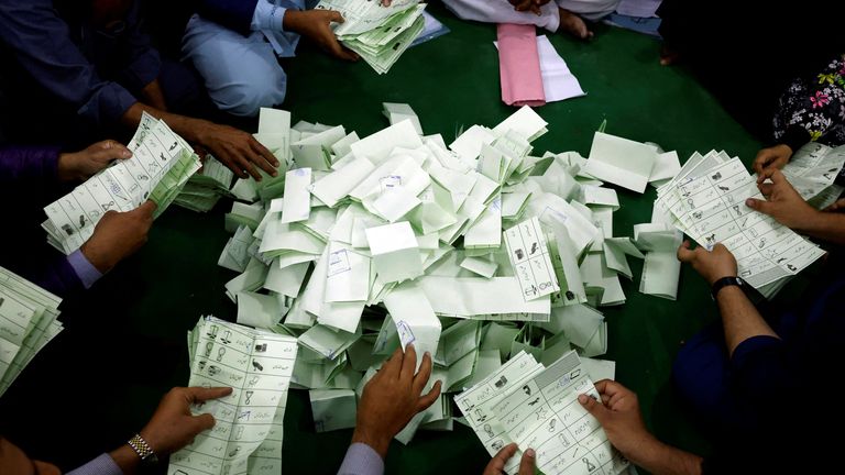 Polling officers count ballots in Karachi.
Pic: Reuteres