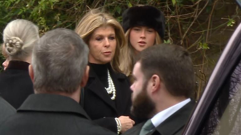 Mourners arrive at the funeral of former political adviser Derek Draper.