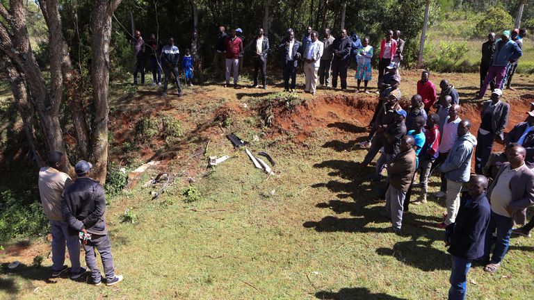 People gather at the scene of accident in which Kenya's marathon world record holder Kelvin Kiptum and his coach were killed along the Kaptagat-to-Eldoret highway