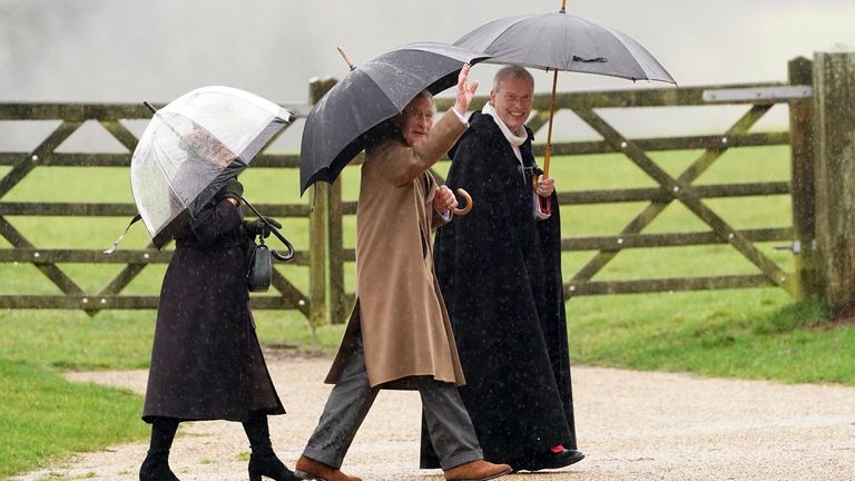 King Charles III waves before Sunday service at Sandringham. Pic: PA