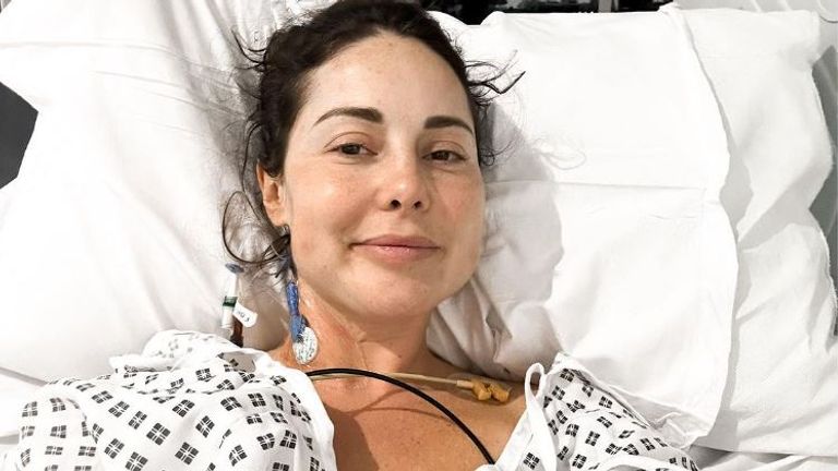 Louise Thompson shared a photo of herself in a hospital bed on Instagram. Image: @louise.thompson