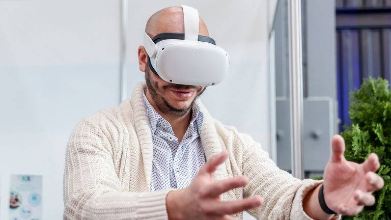 A man tries out a Meta virtual reality headset. Pic: AP
