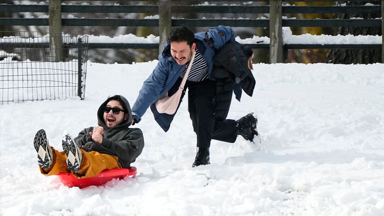 People use their snow sled in New York&#39;s Central Park Tuesday, Feb. 13, 2024, in New York. (AP Photo/Frank Franklin II)