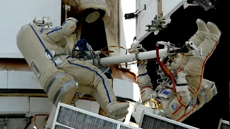 In this photo taken from video footage released by Roscosmos Space Corporation, Russian cosmonauts Oleg Kononenko, right, and Nikolai Chub conduct a spacewalk outside the International Space Station (ISS), Wednesday, Oct. 25, 2023. During the spacewalk, Kononenko and Chub are set to inspect and photograph an external backup radiator on the Nauka multipurpose laboratory module that leaked coolant on Oct. 9 and perform other tasks. (Roscosmos Space Corporation via AP)