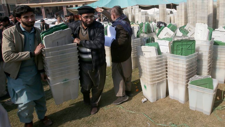 Members of polling staff collect material for the general elections. Pic: AP