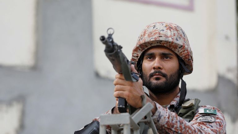 A soldier stands guard along a road, ahead of the general elections in Karachi, Pakistan
Pic: Reuters
