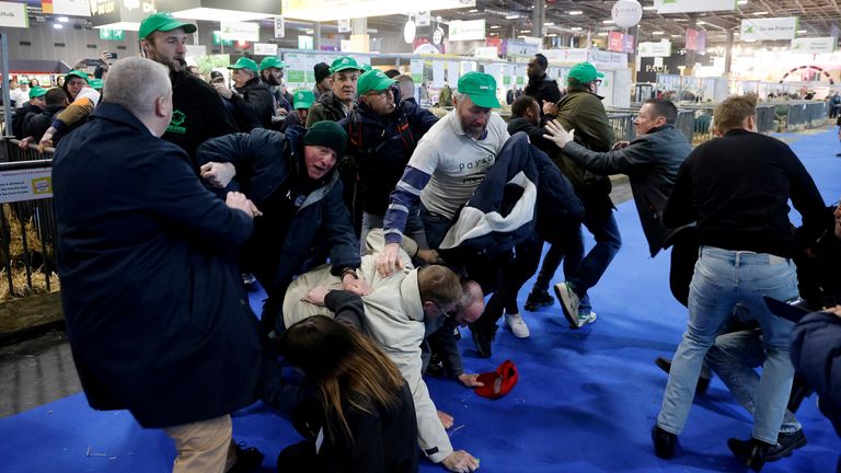 Protesters wearing caps of the FNSEA gather to protest at the opening of the 60th International Agriculture Fair (Salon de l&#39;Agriculture) at the Porte Versailles exhibition centre in Paris, France, February 24, 2024. Ludovic Marin/Pool via REUTERS
