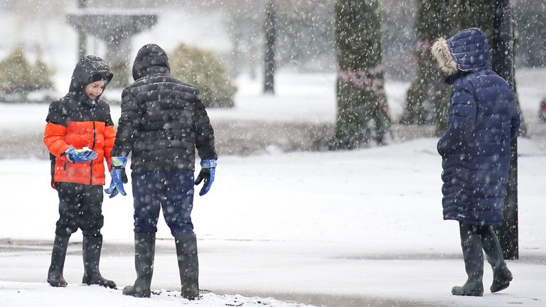 People out enjoying the snow in Pavilion Gardens, Buxton, Peak District.
Pic:PA