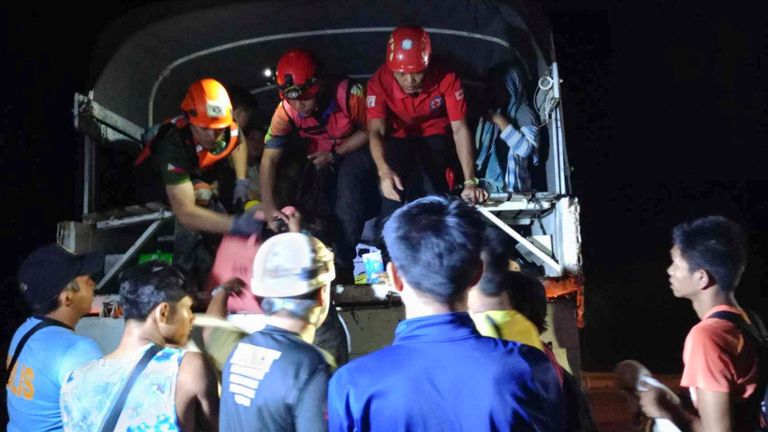 Residents are evacuated from the area in Maco amid fears of more deadly landslides. Pic: Philippine Red Cross/AP