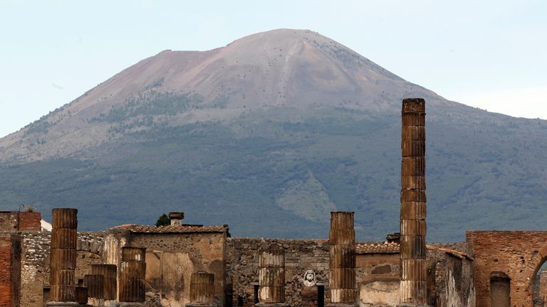 A partial view of the ancient archaeological site of Pompeii is pictured in front of Mount Vesuvius April 17, 2014. Italy&#39;s Culture Minister Dario Franceschini on Thursday will inaugurate three restored domus at Pompeii with the aim of attracting Easter visitors, according to Ansa news. REUTERS/Ciro de Luca (ITALY - Tags: SOCIETY TRAVEL)
