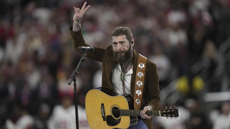 Post Malone performs "America the Beautiful" before the NFL Super Bowl 58 football game Sunday, Feb. 11, 2024, in Las Vegas. (AP Photo/Doug Benc)