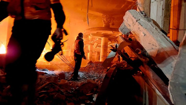 A member of the Palestinian Civil Defence works at the site of Israeli strikes in Rafah.
Pic:  Palestinian Civil Defence/Reuters