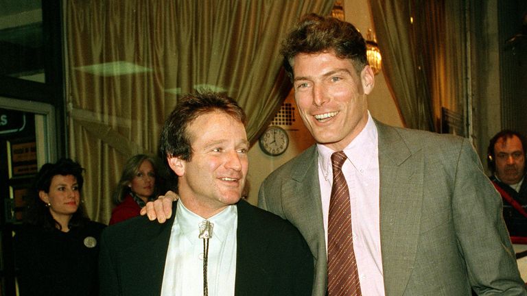 Actor Christopher Reeve, right, poses with colleague Robin Williams as he attends the premiere of Williams' new motion picture "Good Morning, Vietnam," in New York, December 1987. (AP Photo/Ed Bailey)
