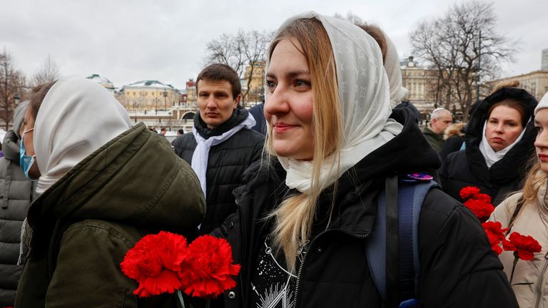 People, including activists of women&#39;s movement "Way Home" and relatives of servicemen of the Russian armed forces involved in a military campaign in Ukraine, gather to lay flowers at the Tomb of the Unknown Soldier by the Kremlin wall as they demand the soldiers&#39; return from Ukraine front, in Moscow, Russia, February 3, 2024. REUTERS/Stringer