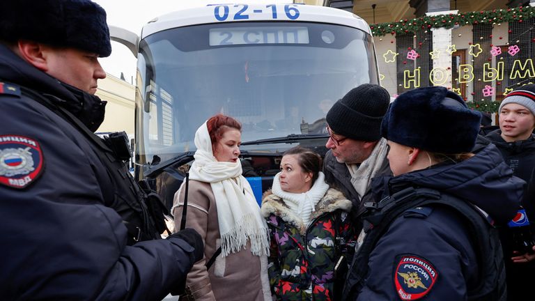 Members of the women&#39;s movement "Way Home", including activist Maria Andreeva, demanding the return of their husbands who joined the Russian armed forces involved in a military campaign in Ukraine, stand surrounded by police officers during a gathering in central Moscow, Russia, February 3, 2024. REUTERS/Stringer