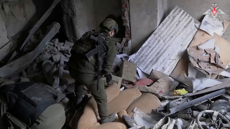 Members of the Russian military inspect a damaged building, in a location given as Avdiivka, Ukraine, in this screen grab obtained from a social media video released February 22, 2024. Russian Defence Ministry/via REUTERS THIS IMAGE HAS BEEN SUPPLIED BY A THIRD PARTY. MANDATORY CREDIT. NO RESALES. NO ARCHIVES.
