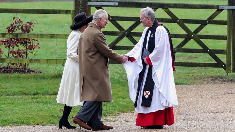 Britain&#39;s King Charles and Reverend Canon Dr Paul Williams shake hands next to Queen Camilla as they arrive for a church service at St. Mary Magdalene&#39;s church on the Sandringham estate in eastern England, Britain, February 11, 2024. REUTERS/Chris Radburn