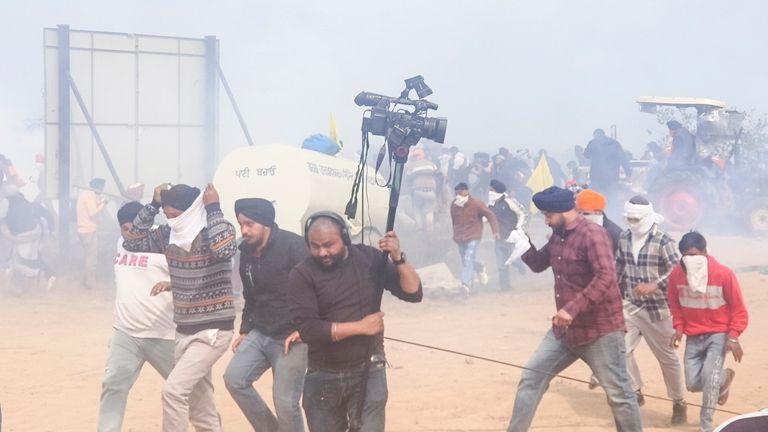 A camera man joins farmers running for cover after police fired tear gas to disperse protesting farmers who were marching to New Delhi near the Punjab-Haryana border at Shambhu.
Pic: AP