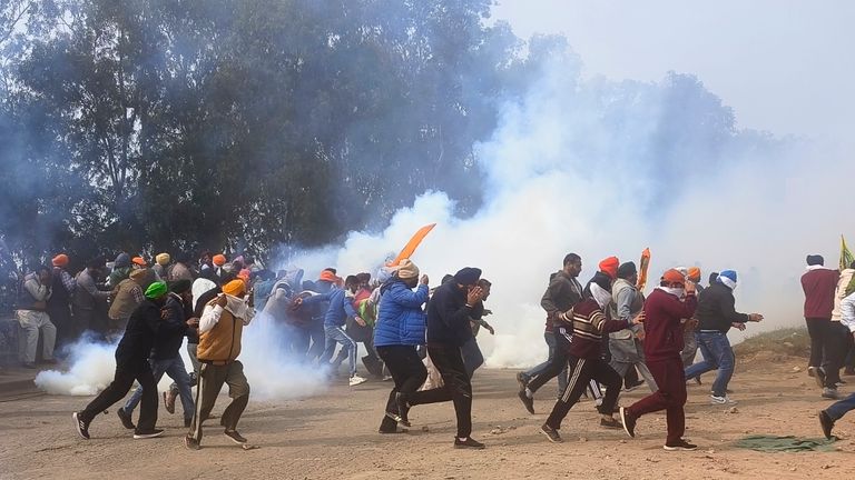 Farmers run for cover after police fired tear gas to disperse protesting farmers who were marching to New Delhi near the Punjab-Haryana border at Shambhu
Pic: AP