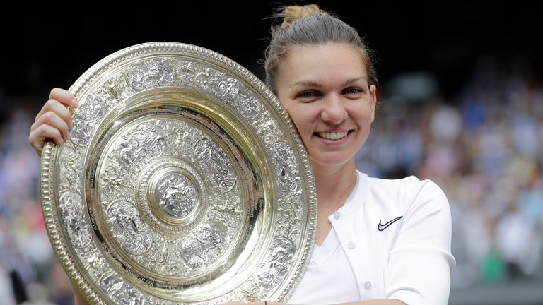 FILE - Romania&#39;s Simona Halep holds the trophy after defeating Serena Williams in the women&#39;s singles final of the Wimbledon Tennis Championships in London, July 13, 2019. Two-time Grand Slam champion Simona Halep has been suspended from professional tennis for four years for alleged doping violations, the International Tennis Integrity Agency said Tuesday, Sept. 12, 2023. (AP Photo/Ben Curtis, File)