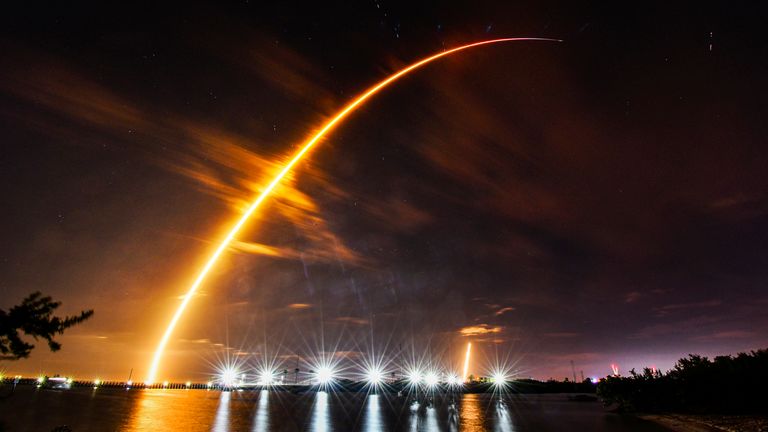 A SpaceX Falcon 9 rocket is launched from a pad at Kennedy Space Center, seen from Port Canaveral, Fla. Thursday, Feb. 15, 2024. (Malcolm Denemark/Florida Today via AP)