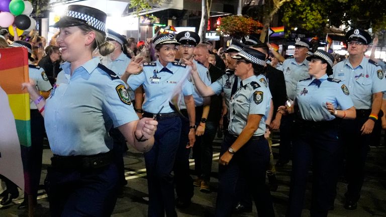 Karen Webb (second left) waving as she marched in the 2023 Mardi Gras parade in Sydney. Pic: AP