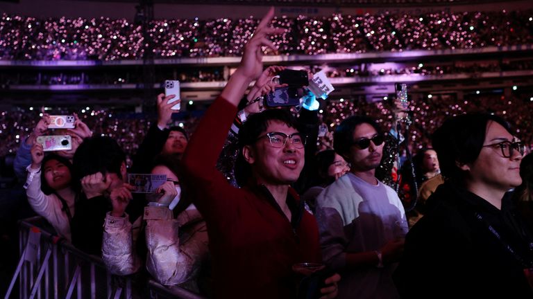 Fans in the stands at Swift&#39;s Eras Tour show in Tokyo. Pic: Reuters