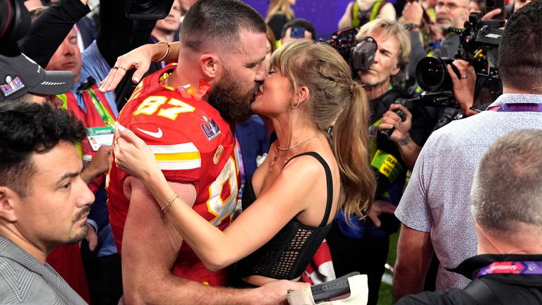 Taylor Swift kisses Kansas City Chiefs tight end Travis Kelce after the NFL Super Bowl 58 football game against the San Francisco 49ers, Sunday, Feb. 11, 2024, in Las Vegas. The Chiefs won 25-22. (AP Photo/John Locher)