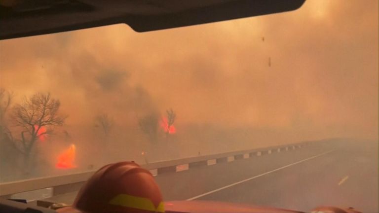 Fire truck drives through inferno