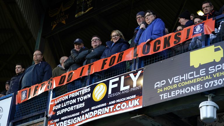 Fans raise a banner for Tom Lockyer.  Photo: PA