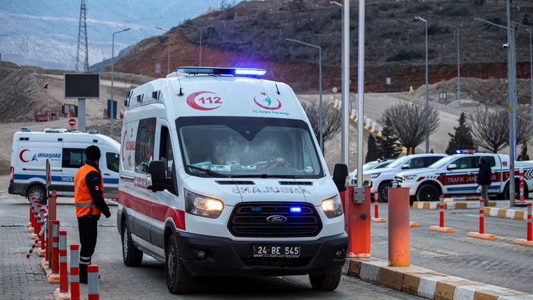 An ambulance leaves the Copler gold mine near Ilic village, eastern Turkey, Wednesday, Feb. 14, 2024. Hundreds of rescuers on Wednesday pressed ahead with efforts to search for several workers trapped at a gold mine in eastern Turkey that was engulfed by a massive landslide. (Ugur Yildirim/Dia images via AP)