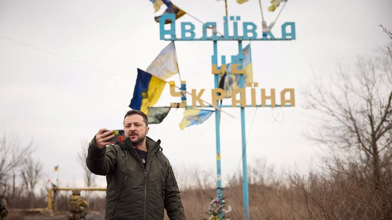 FILE PHOTO: Ukraine&#39;s President Volodymyr Zelenskyy takes a video in front of a road sign with the words "Avdiivka this is Ukraine", amid Russia&#39;s attack on Ukraine, as he visits in the frontline town of Avdiivka Donets region, Ukraine December 29, 2023. Ukrainian Presidential Press Service/Handout via REUTERS ATTENTION EDITORS - THIS IMAGE HAS BEEN SUPPLIED BY A THIRD PARTY./File Photo
