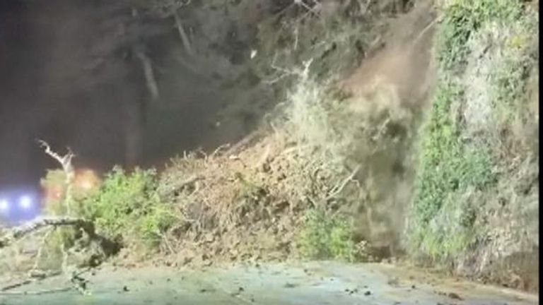 US: Moment landslide crashes onto highway after severe storms