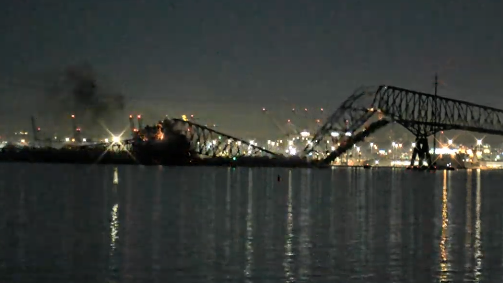 Vehicles fall into water as bridge collapses after being hit by ship in Baltimore