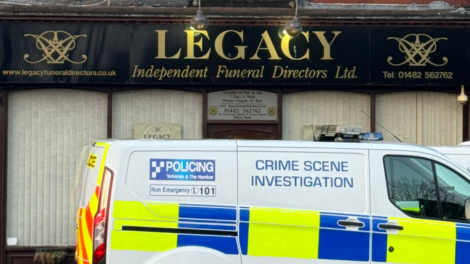 Man and woman arrested after 34 bodies removed from funeral parlour in police raid