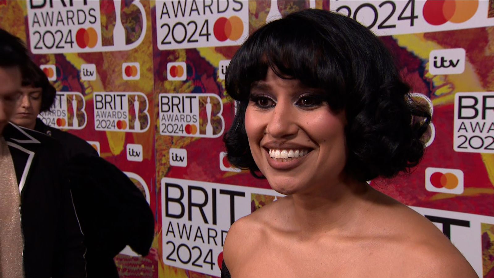 Raye calls success 'a miracle' on Brits 2024 red carpet Ents & Arts