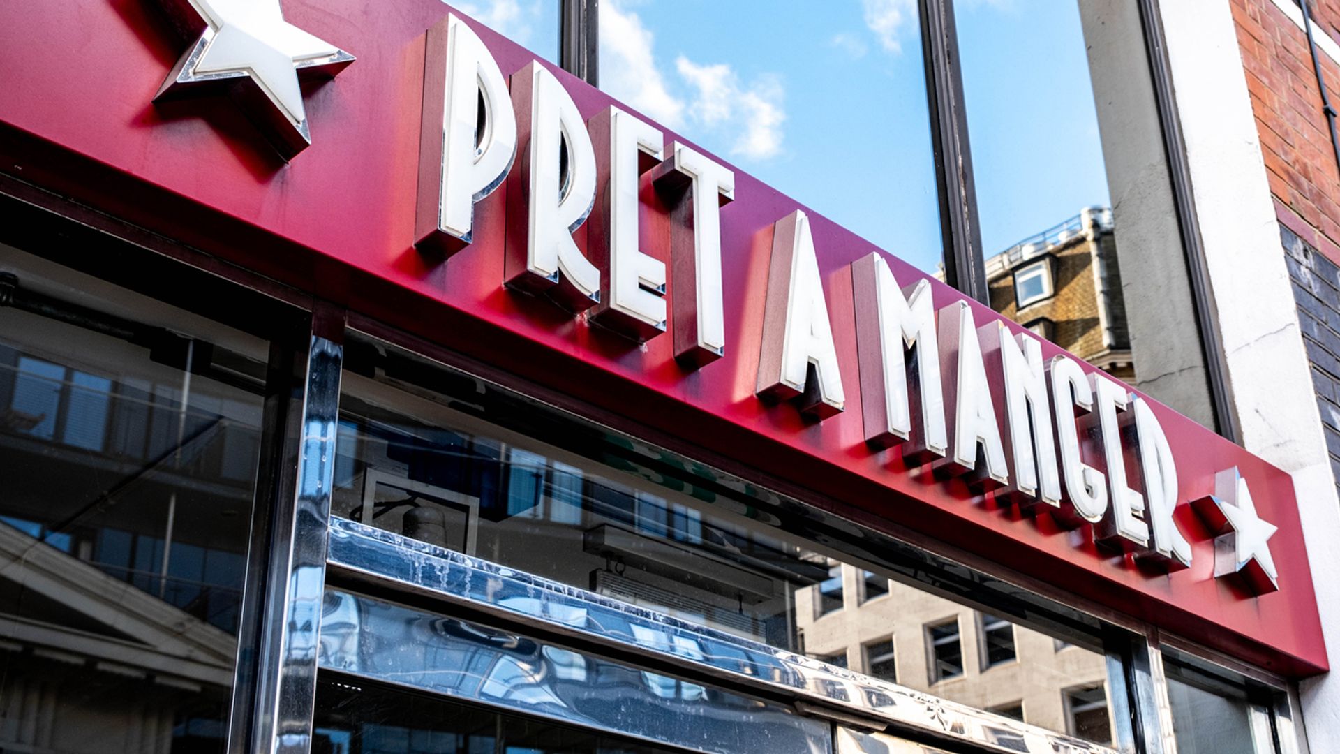 Pret books &#163;553m charge on UK tax hikes and global uncertainty