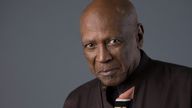 FILE - Louis Gossett Jr. poses for a portrait in New York to promote the release of "Roots: The Complete Original Series" on Bu-ray on May 11, 2016. Gossett Jr., the first Black man to win a supporting actor Oscar and an Emmy winner for his role in the seminal TV miniseries “Roots,” has died. He was 87. (Photo by Amy Sussman/Invision/AP, File)