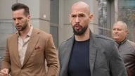 Andrew Tate, right, and his brother Tristan leave the tribunal in Bucharest, Romania, Thursday, Feb. 29, 2024. (AP Photo/Vadim Ghirda)