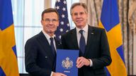 (L-R) US secretary of state Antony Blinken receives Sweden&#39;s accession documents from Swedish PM Ulf Kristersson. Pic: AP
