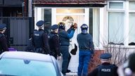 Officers raid a house in a county lines crackdown. Pic: Merseyside Police
