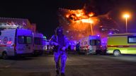 A Russian National Guard serviceman in front of Crocus City Hall. Pic: AP