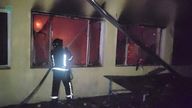 An emergency services personnel works at the site of a Russian drone attack in a location given as Odesa.
Pic:Defence Forces Southern Ukraine/Reuters