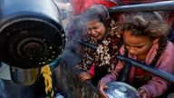 Children waiting to receive food in Rafah, in the southern Gaza Strip. Pic: Reuters