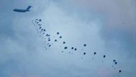 An aircraft airdrops humanitarian aid over Gaza the northern Gaza Strip, as seen from southern Israel.
Pic: AP