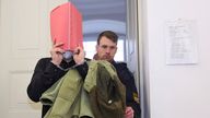 11 March 2024, Bavaria, Kempten: The defendant is led into a courtroom at the regional court, on the left his lawyer Philip M&#39;ller. Following the violent attack on two young American women not far from Neuschwanstein Castle, the 31-year-old was sentenced to life imprisonment. On Monday, the district court in Kempten deemed the crime committed by the man, who is also from the USA, to be murder, attempted murder and rape resulting in death. Photo by: Karl-Josef Hildenbrand/picture-alliance/dpa/AP 