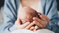 Newborn in mother's hands. Baby care. Childbirth and motherhood concept. Mother and baby. Pic: iStock