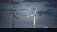 File photo dated 26/07/2022 of a ship passing wind turbines at RWE&#39;s Gwynt y Mor, the world&#39;s 2nd largest offshore wind farm located eight miles offshore in Liverpool Bay, off the coast of North Wales. The Crown Estate is to pay even more money to the Treasury after benefiting from a massive licensing round for offshore wind power last year. The company, which owns the seabed around the UK, said it made £442.6 million in net revenue profit in the year to the end of March, money that will go to h