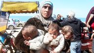 A Palestinian woman fleeing Al Shifa hospital following an Israeli raid, carries her triplet children as she moves southward.
Pic:Reuters