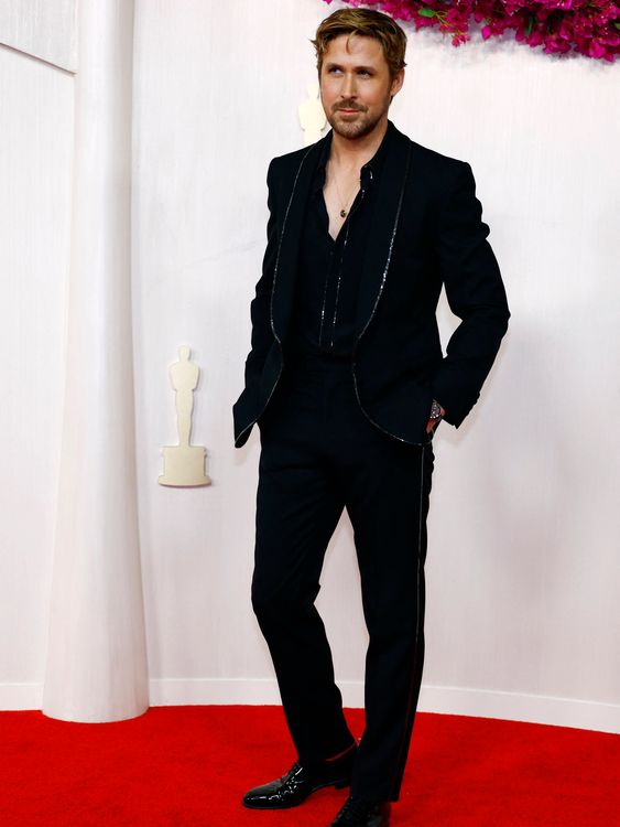 Barbie star Ryan Gosling, bearing a little chest and a cheeky smile for the cameras. Pic: Reuters